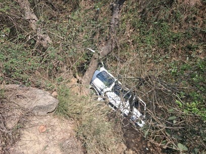 Van falls into drain, three injured