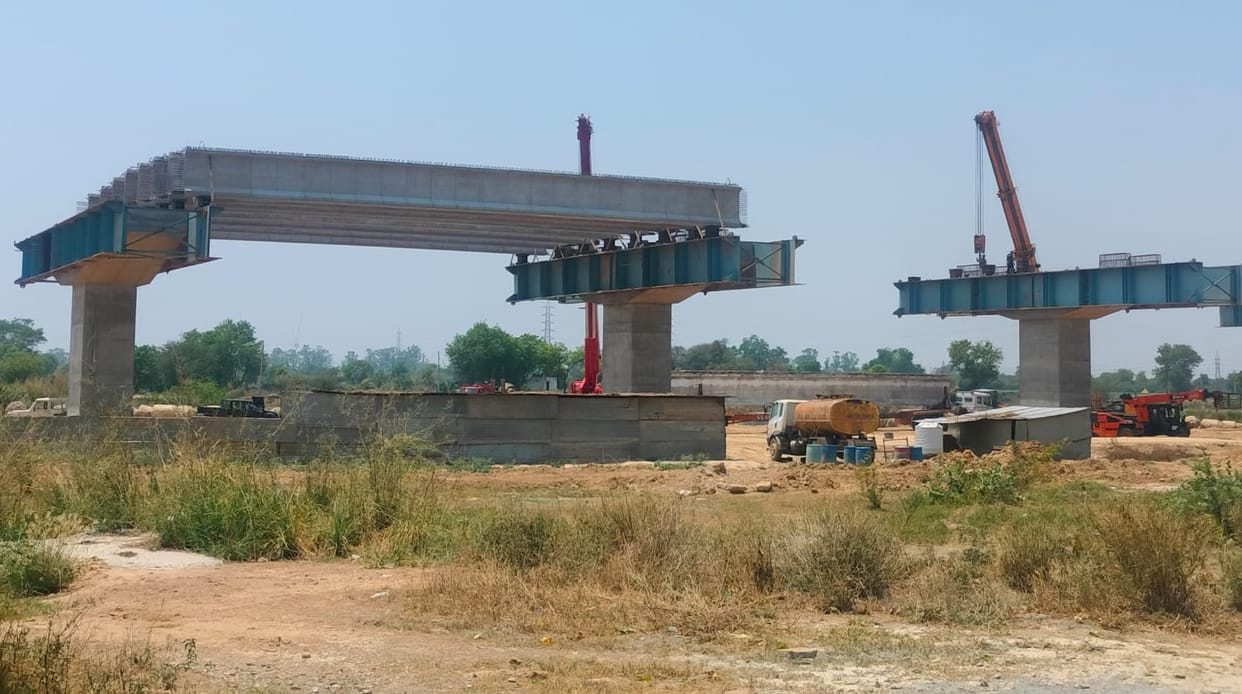 Girder laying work underway on pillars near village Phaphunda, Greenfield Expressway
