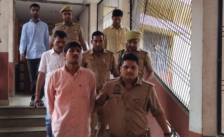 Seven people, including a former village head, were sentenced to life imprisonment for the murder of a father and son.