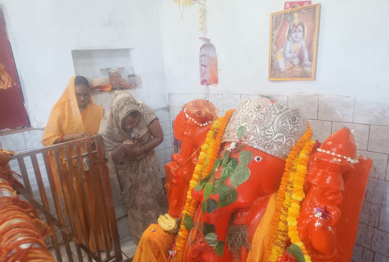 Devotees throng the South-facing Ganesha Temple.