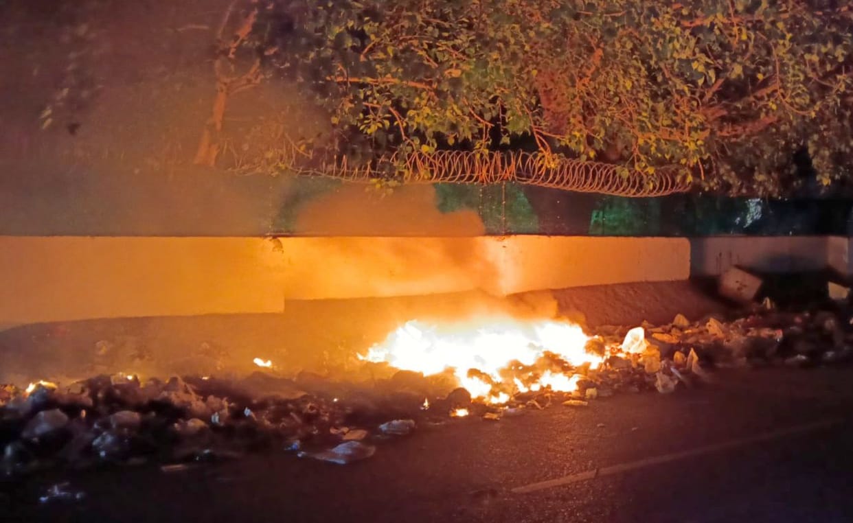 Due to the lack of proper waste disposal, garbage is being set on fire at night.