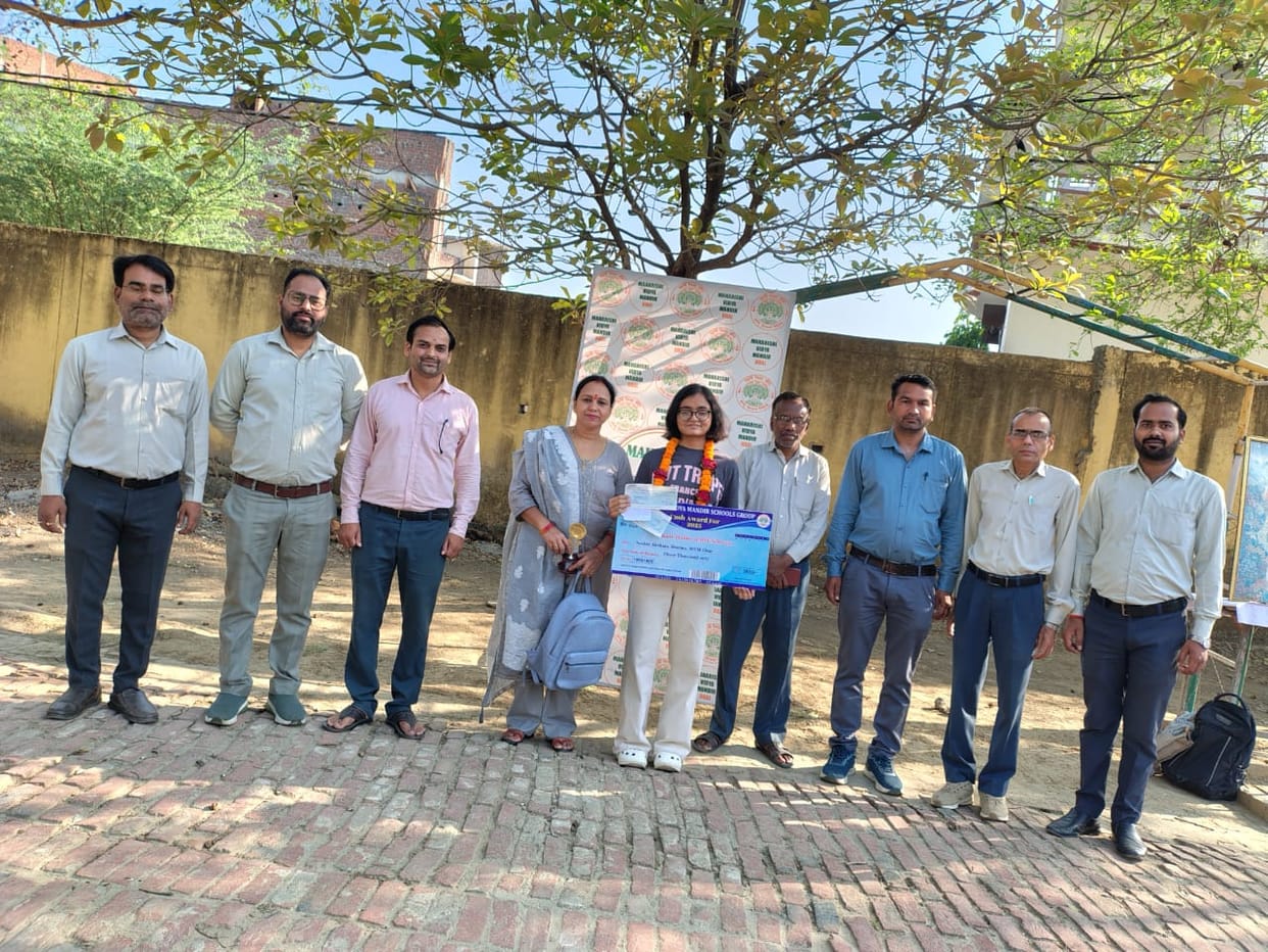 Akshara Sharma, who secured third position in the country, was honored.