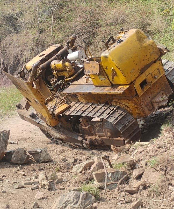 A bulldozer lost control and fell into a ditch after the road caved in, killing the driver.
