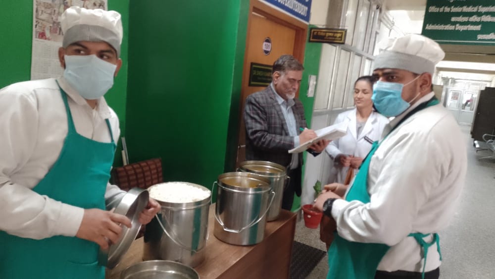 Food is being served to patients after quality check.