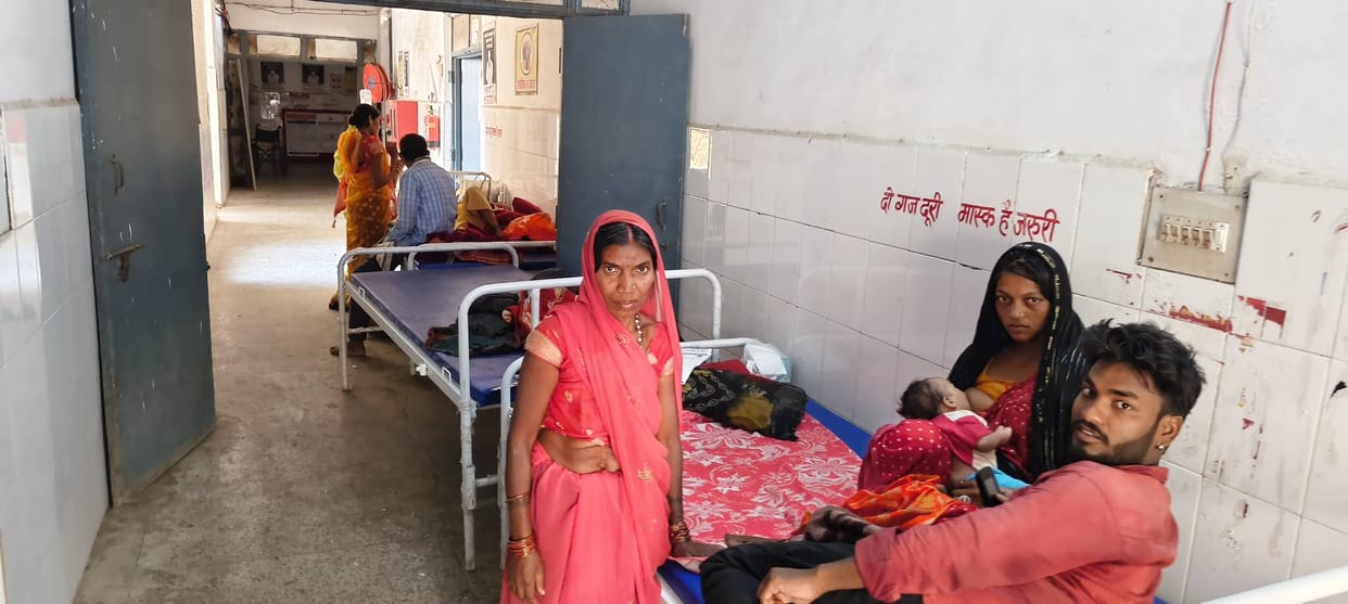 Patients are being treated on beds set up in the corridor of the CHC.