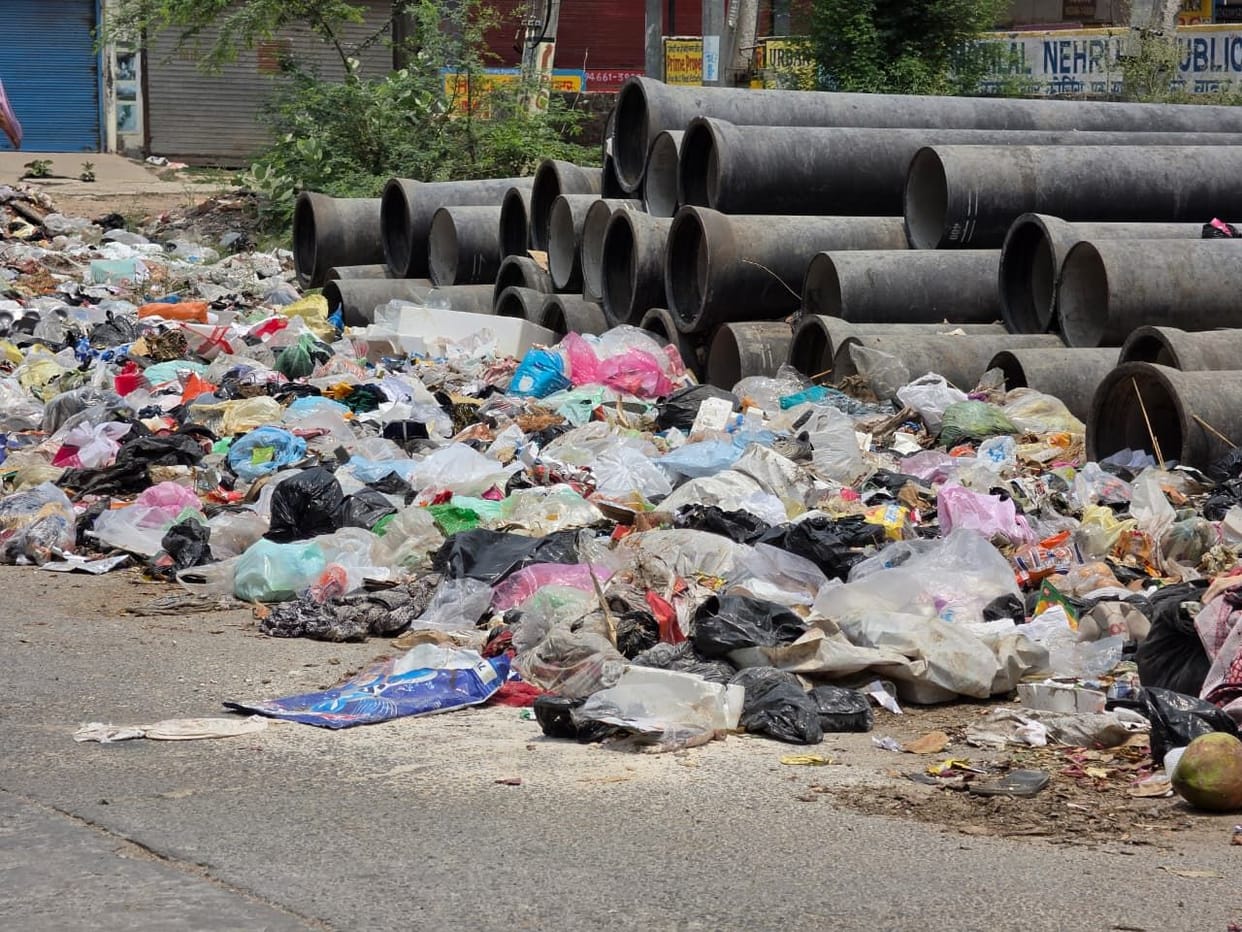 Heaps of garbage pile up in the city due to the sanitation workers' strike.