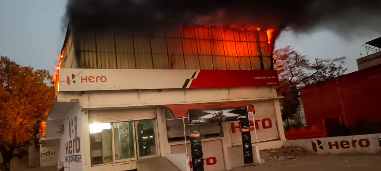 Fire breaks out at automobile garage; panic ensues.