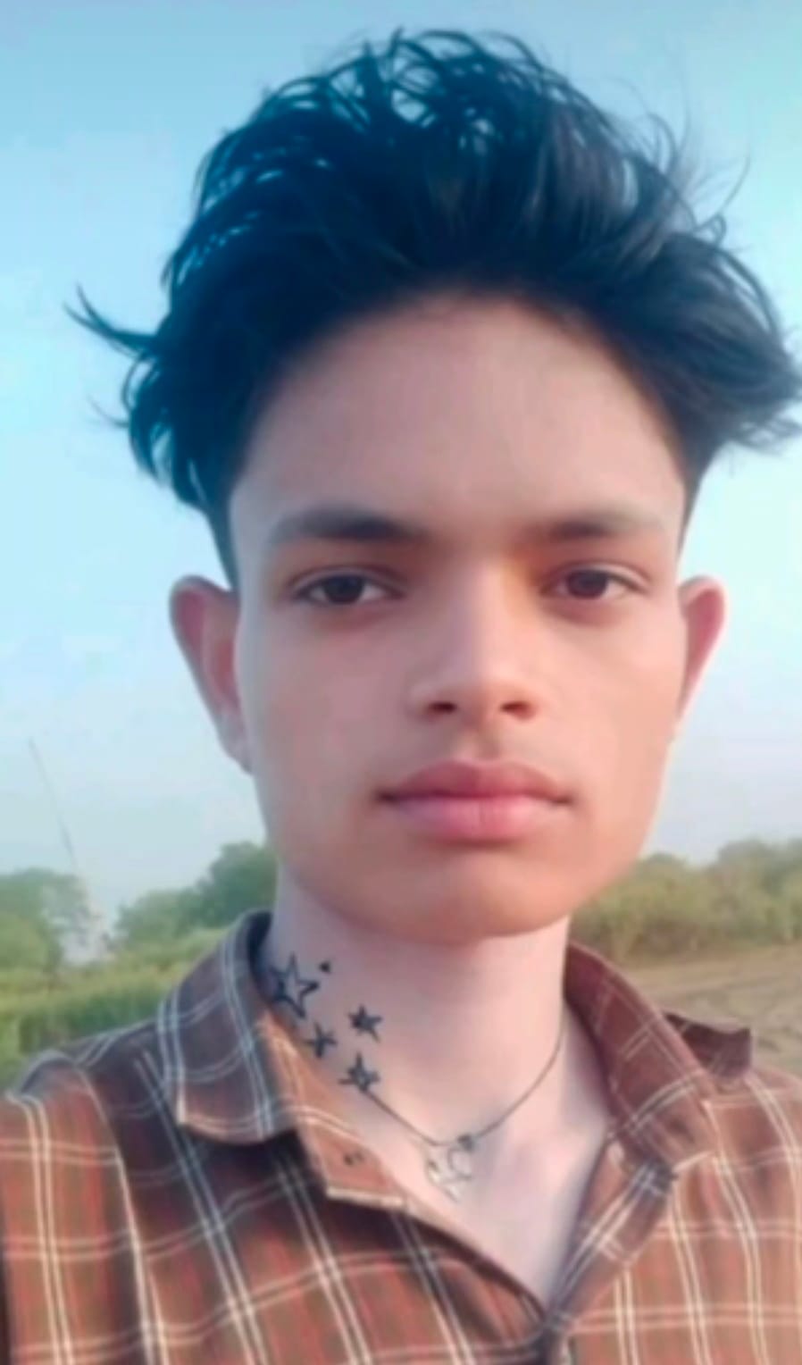 Teenager's body found hanging from a tree in the garden.
