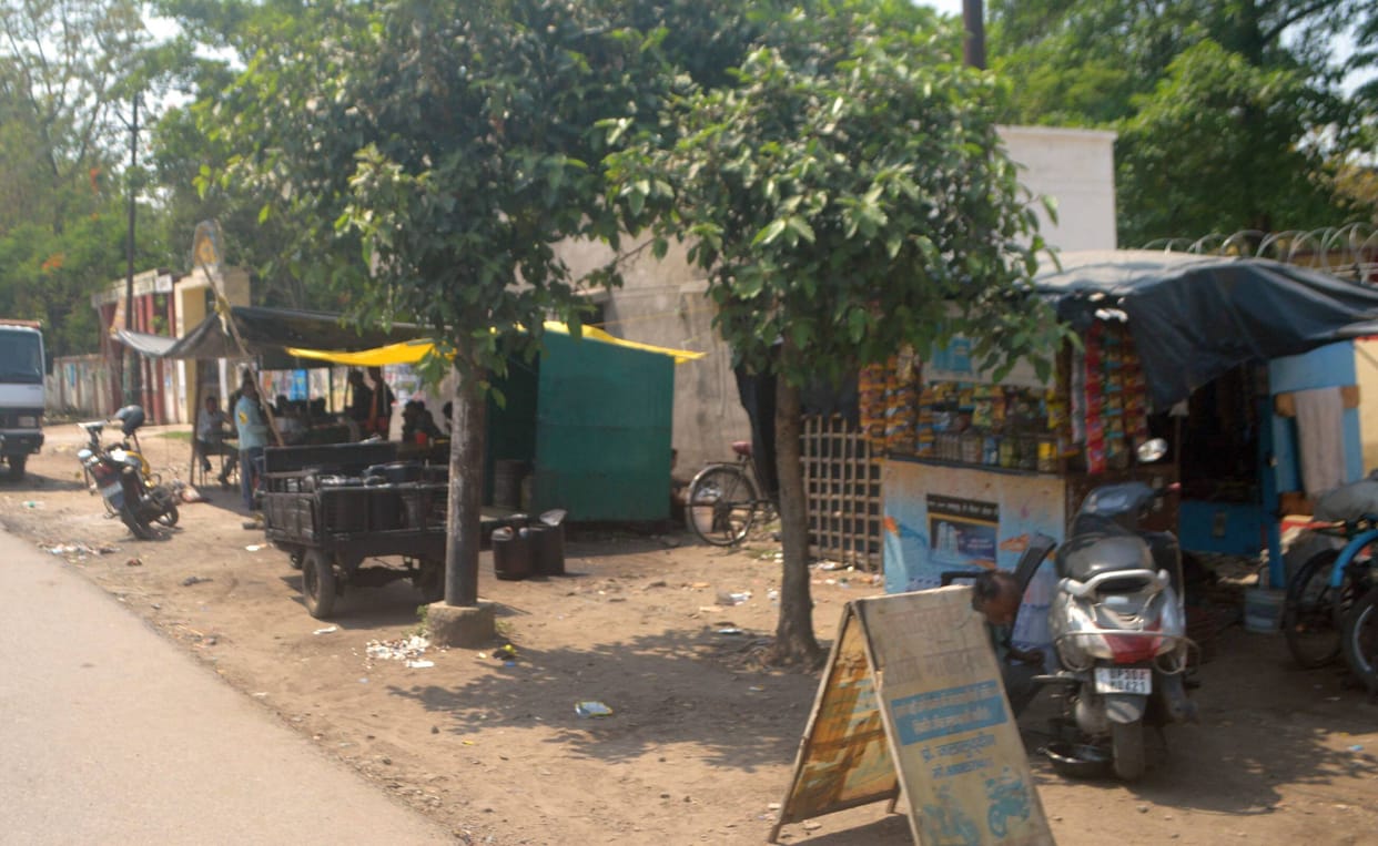 Pan and cigarette shops at the gate of GGIC, liquor shops at 300 meters