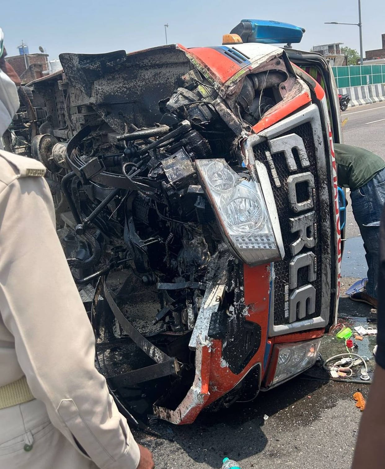 The ambulance overturned after the driver dozed off, injuring four people including the driver.