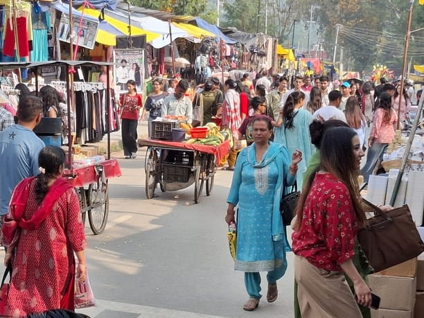 People gathered to shop at the temporary market in Dhalpur.