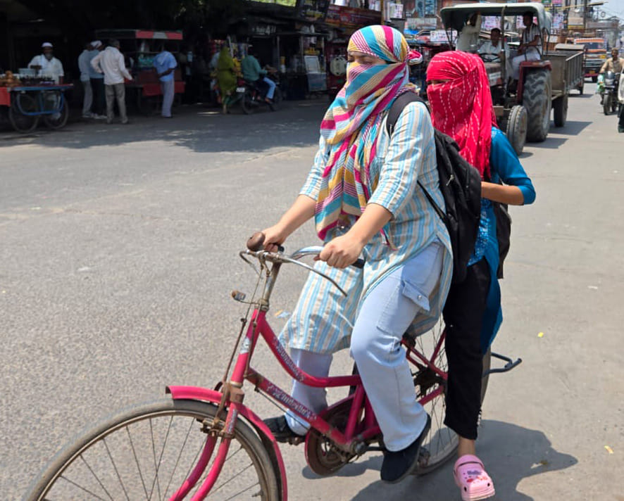 The mercury is rising continuously, people came out in the afternoon covering their faces.