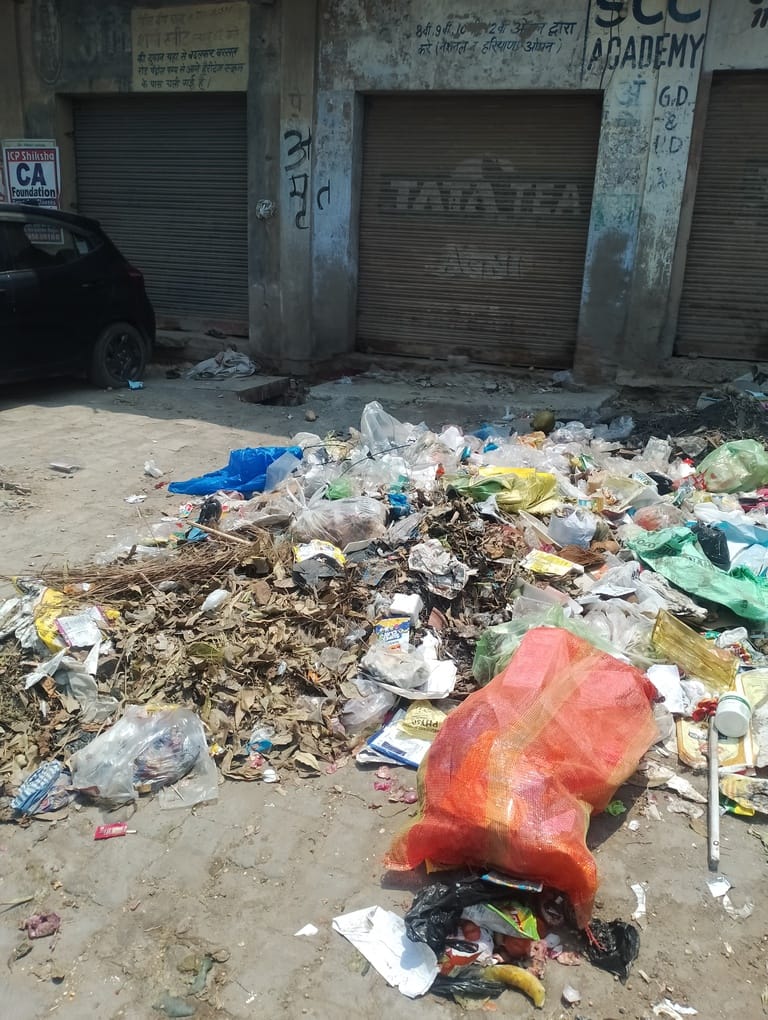 Due to the strike of sanitation workers, garbage piles up everywhere.