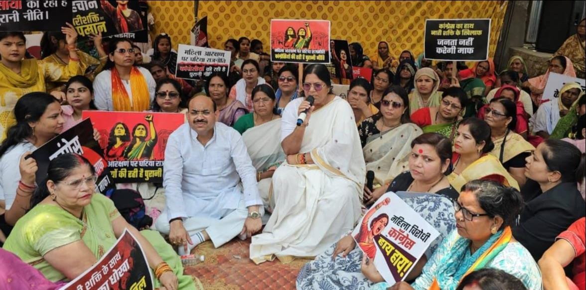 BJP women workers staged a sit-in protest near the MP's residence.