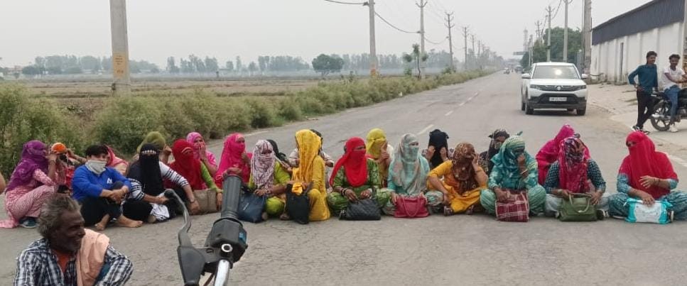 Workers protest outside plywood factory, block road