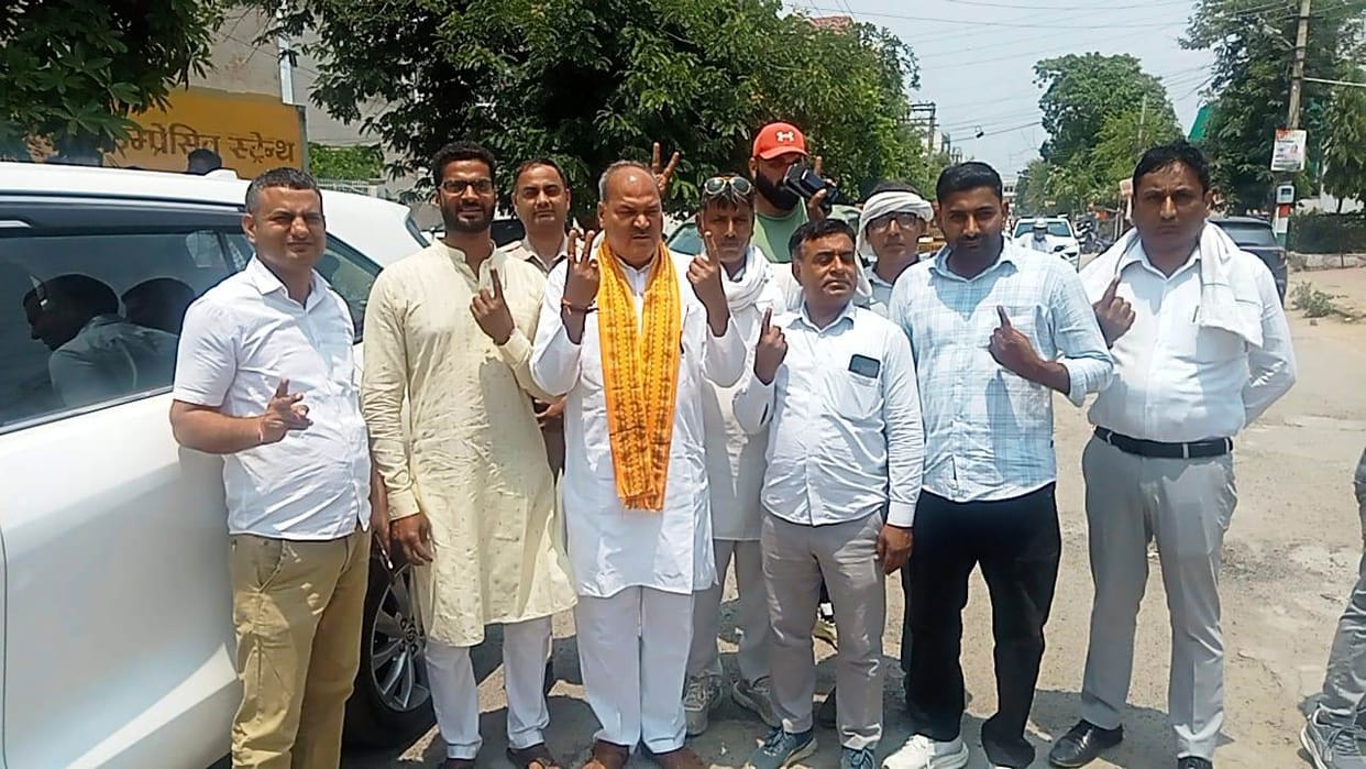 MLA casts vote with family