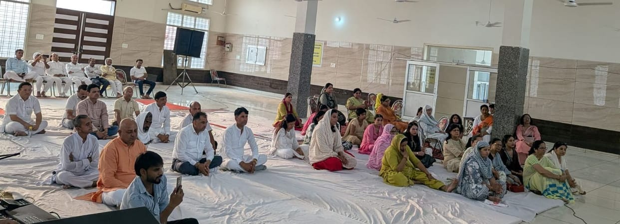 Devotees swayed in devotional fervor, as the strains of spiritual *sankirtan* resounded.