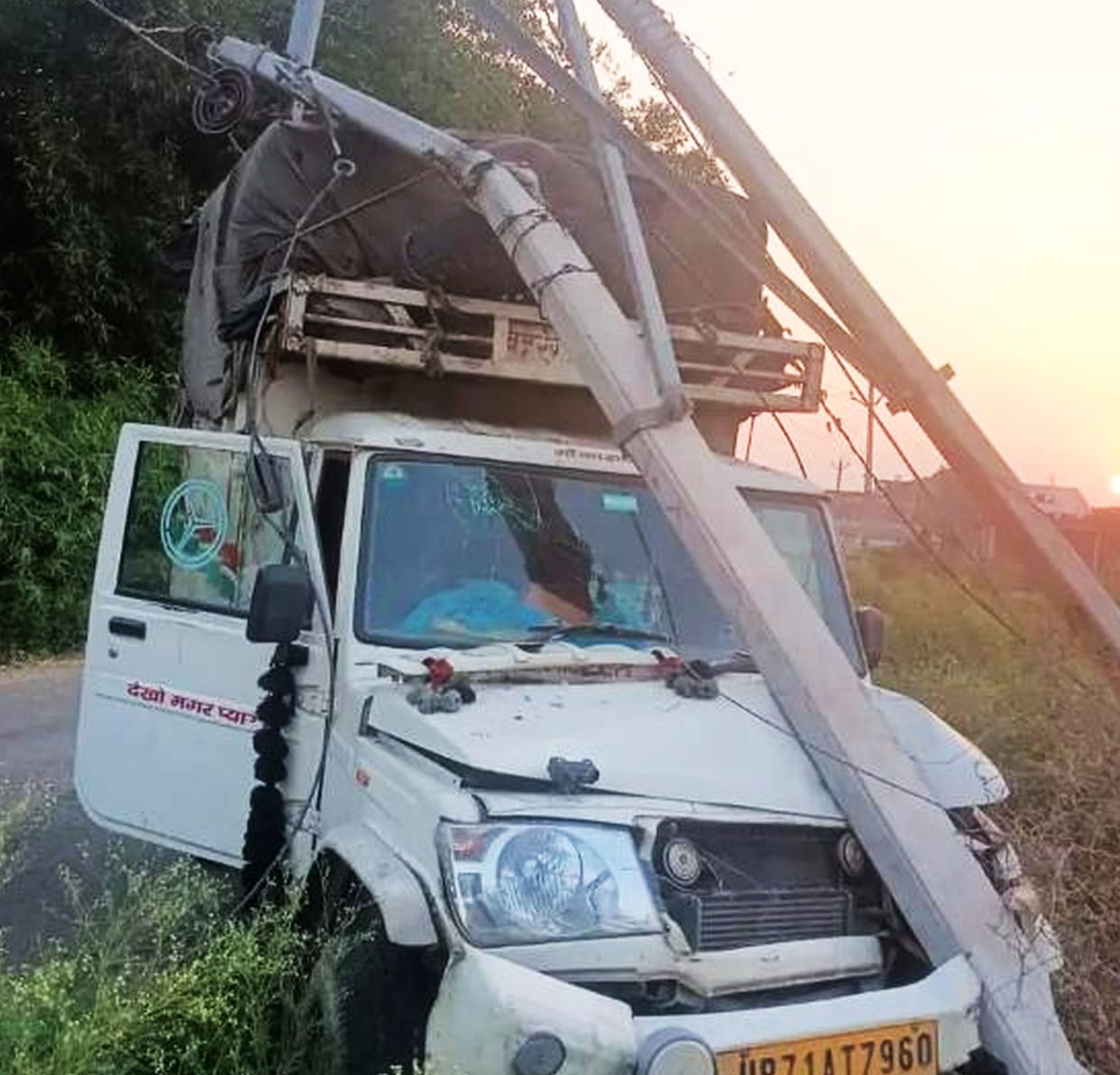 Pickup collides with high tension pole, driver injured