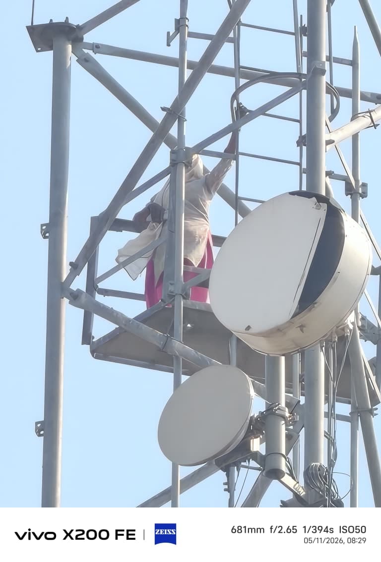 A young woman climbed a mobile tower over a land dispute