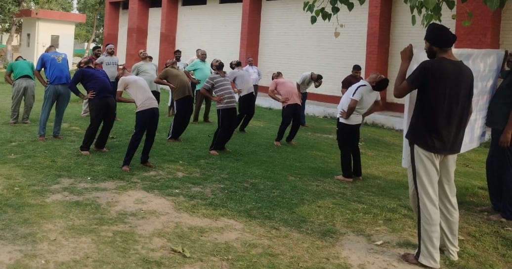The team conducted yoga exercises for the prison staff and prisoners.