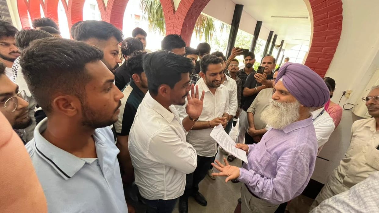 Students jumped over the wall and entered inside to protest against the cancellation of the entrance exam.