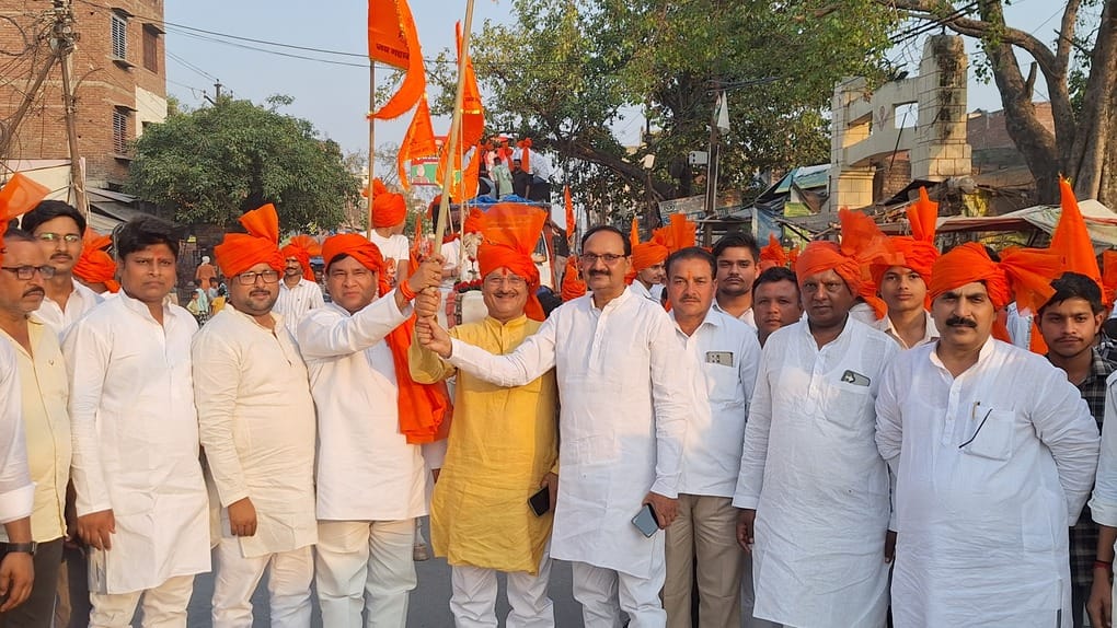 Saffron flags waved and chants of victory resounded during the procession.