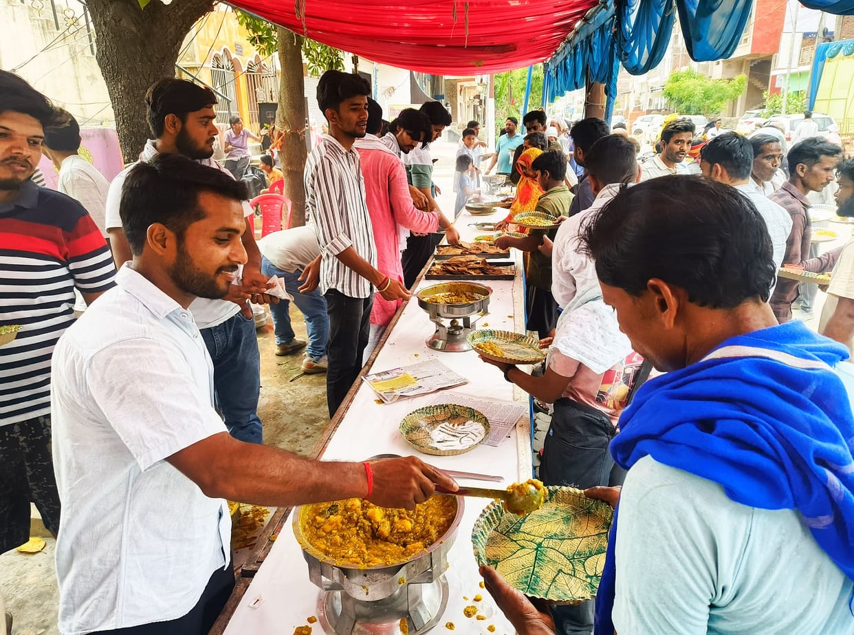 Community feasts held at various locations; chants of "Jai Bajrangbali" reverberate.
