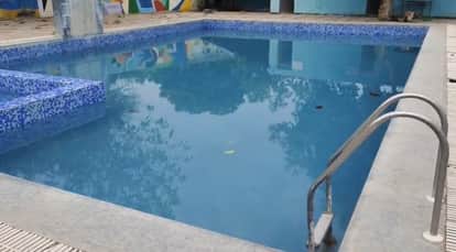 A child drowned in a hotel swimming pool; police will exhume the body again for a post-mortem.