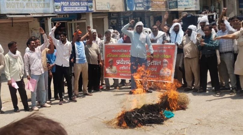 Firefighters burnt an effigy of the government.