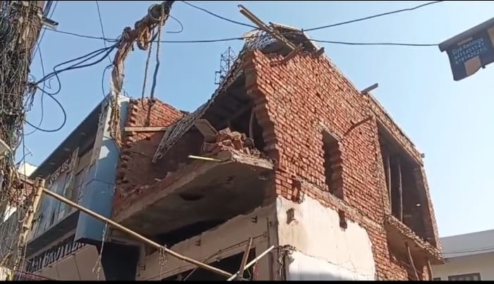 The shuttering on the second floor of the building came crashing down.