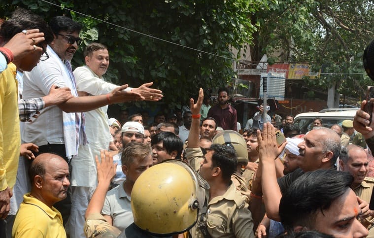 SP and BJP clash over school foundation stone laying; BJP councilor shows slippers, MLA joins hands