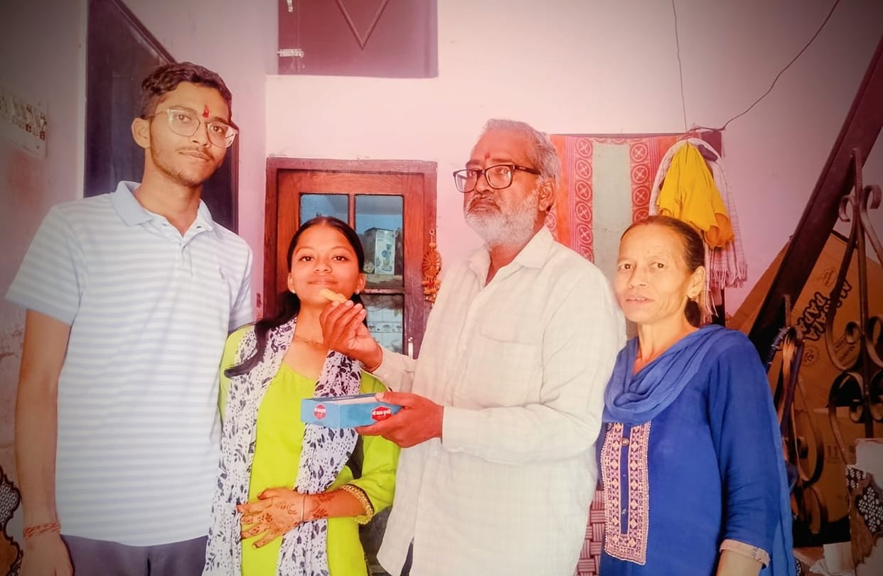 Radhika became the district topper by scoring 98.4 percent marks.