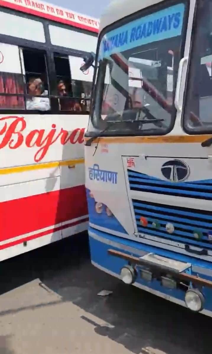 Private bus driver parked his bus in front of a roadways bus, leading to a dispute.