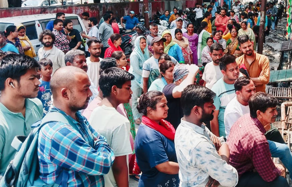 The Indane gas vehicle arrived after two months, drawing a large crowd to collect the cylinders