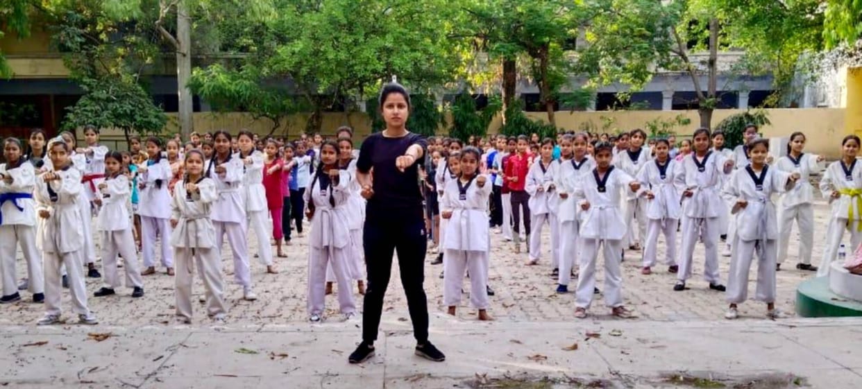 Girls learning self-defense techniques in Taekwondo