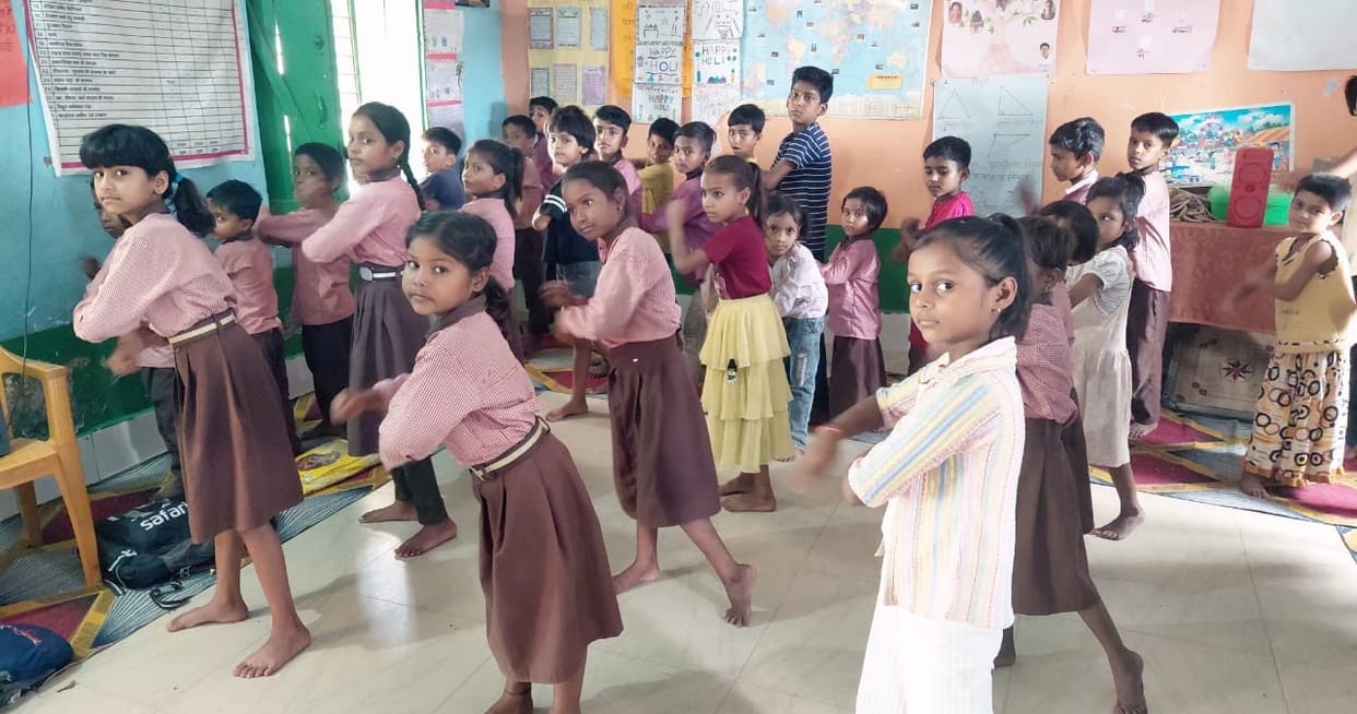 Children danced to folk songs and learned Sanskrit greetings