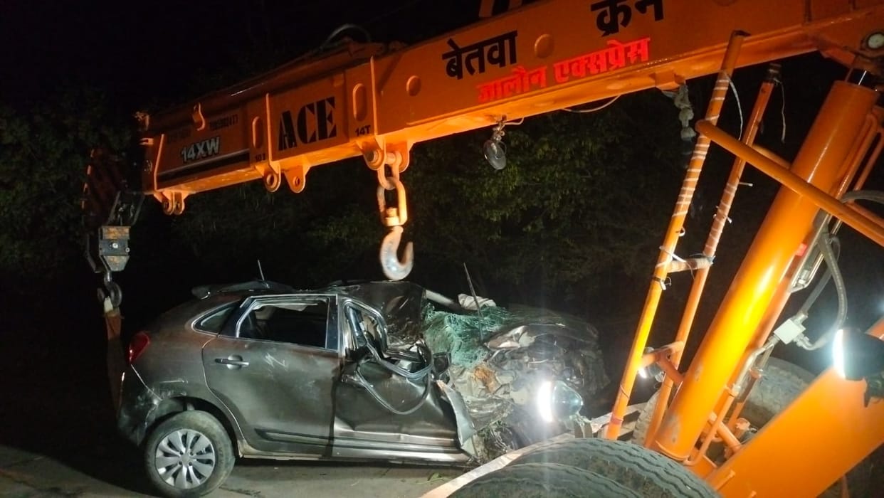 Two youths died after their car collided with a tree and overturned into a ditch