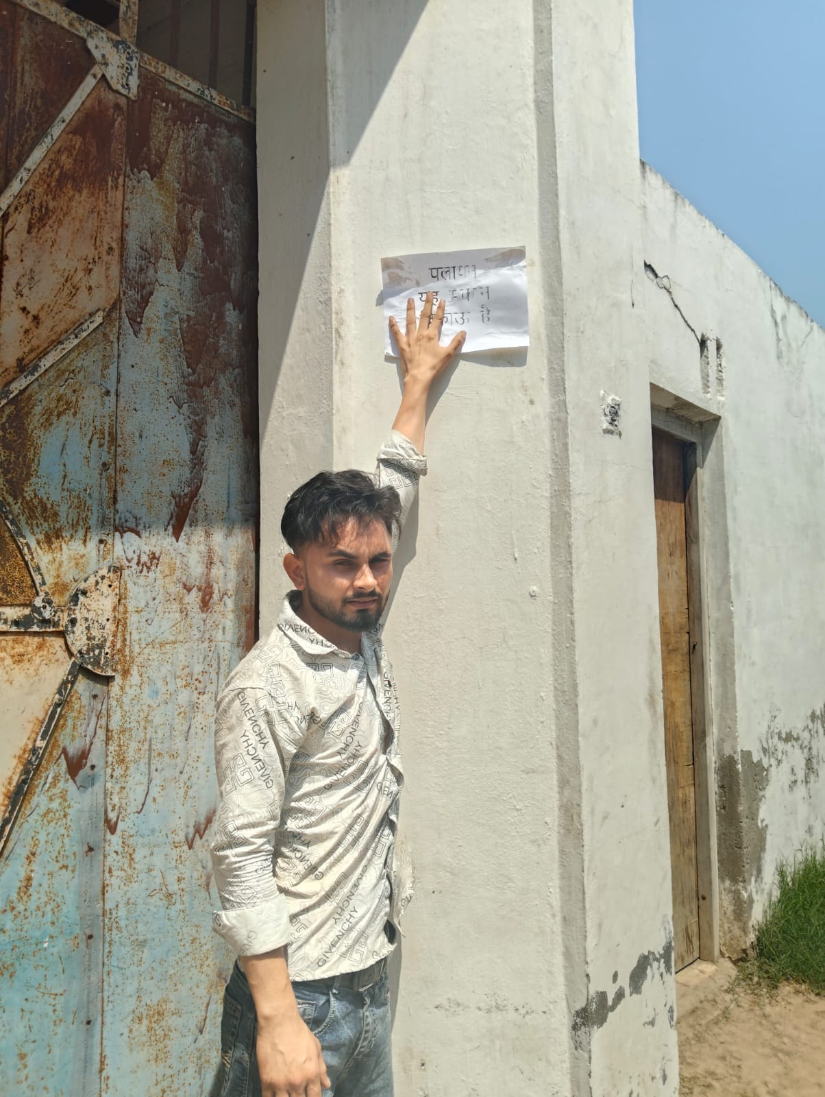 People troubled by waterlogging put up posters of houses for sale on their houses.