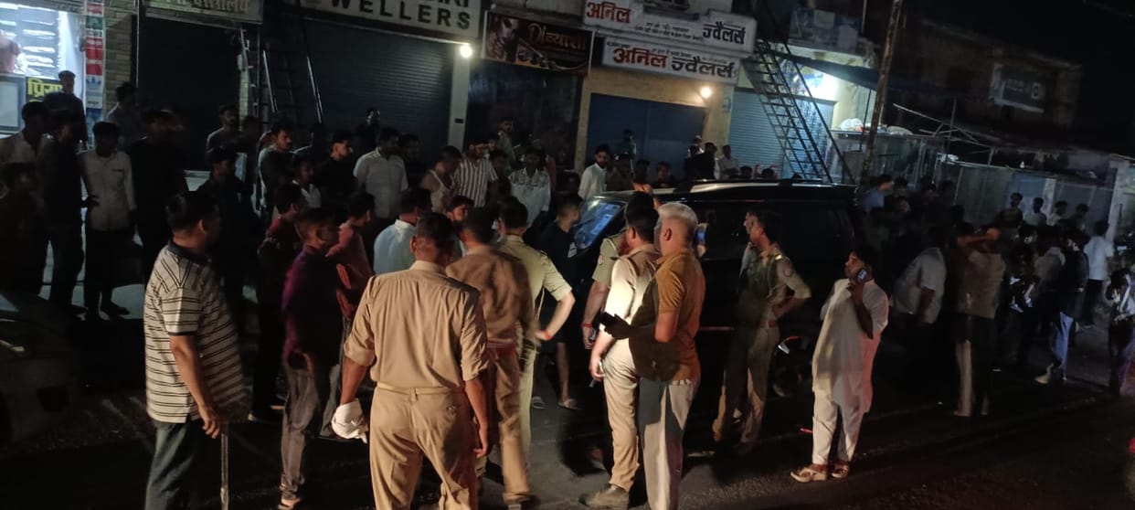 A speeding car ran over people standing near a juice cart, injuring three people, including a girl.
