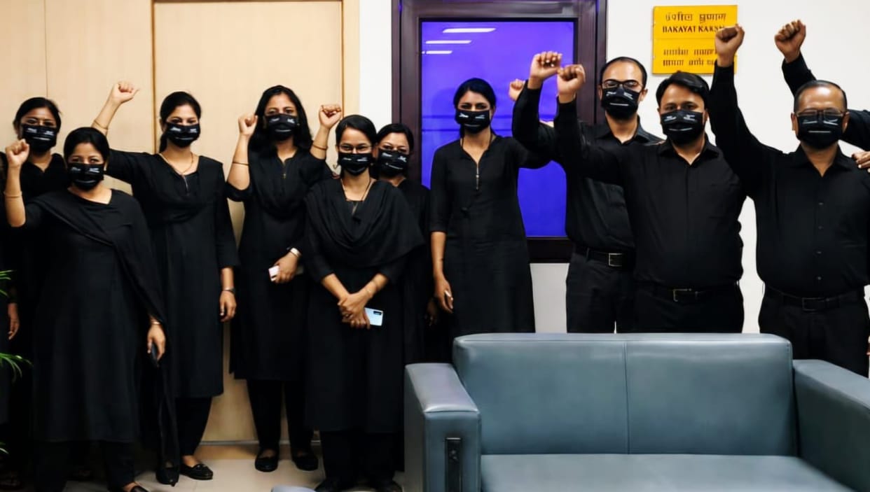Bank employees wore black clothes to work.
