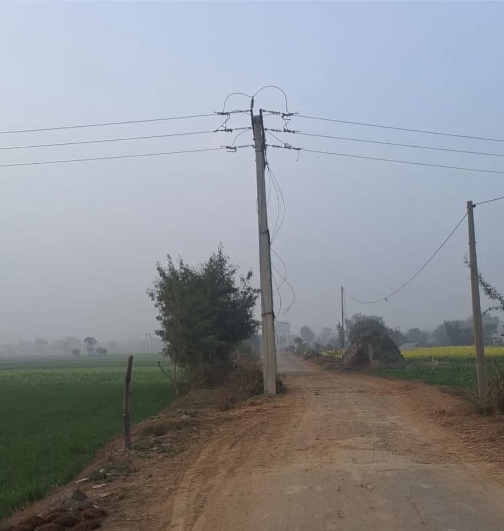 Electricity pole standing in the middle of the road poses a danger, people are worried.