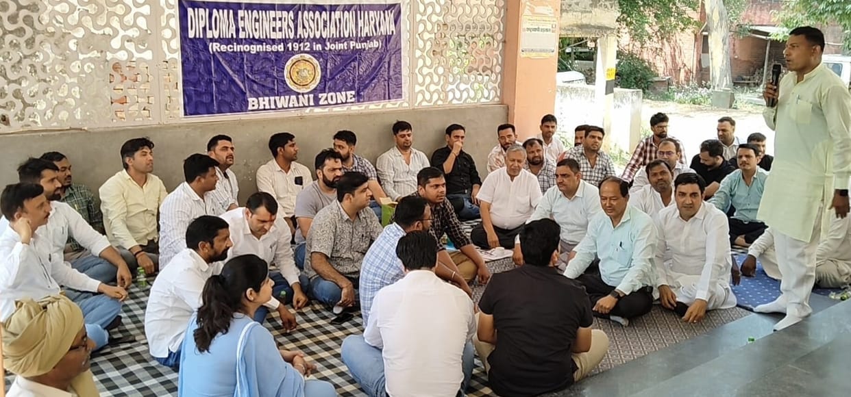 Demanding the reinstatement of two junior engineers, the workers staged a sit-in protest.