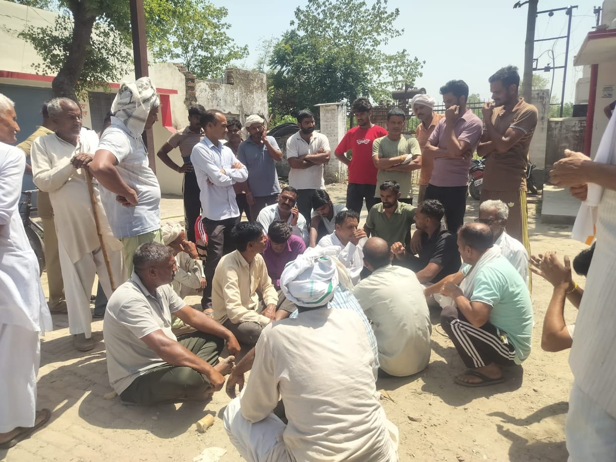 Farmers Stage Sit-in Against Power Cuts; Make Junior Engineer Sit in the Sun