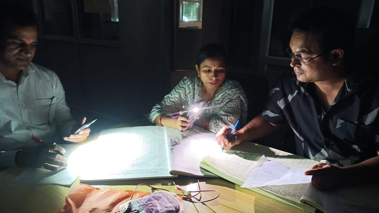 Blood drawn in the blood bank under the light of a mobile phone