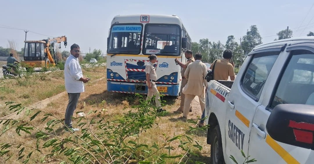 To avoid a car coming in front, the roadways bus was taken out in the green belt.