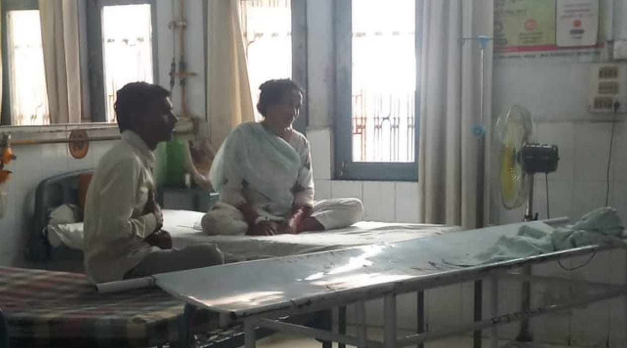 Patients suffering from heat in the district hospital, brought fans from home