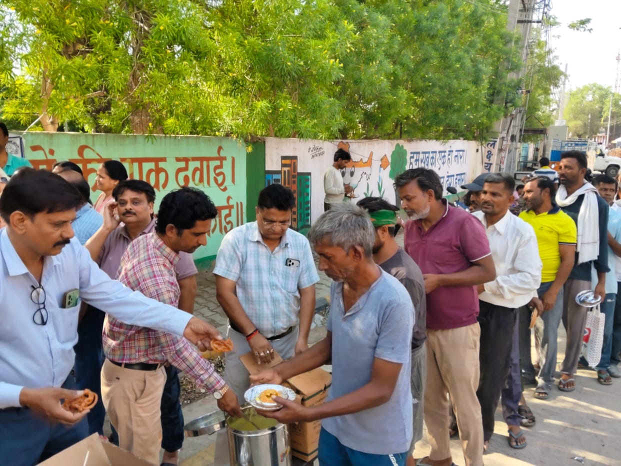 Workers treated to refreshments on a wedding anniversary.