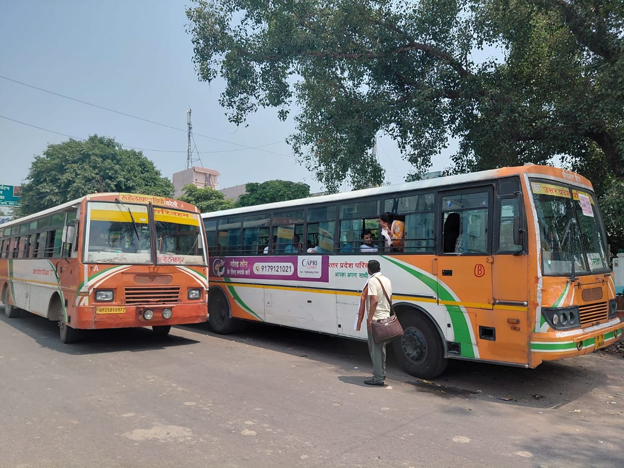 Waiting for buses in the scorching sun, chaos at the temporary station