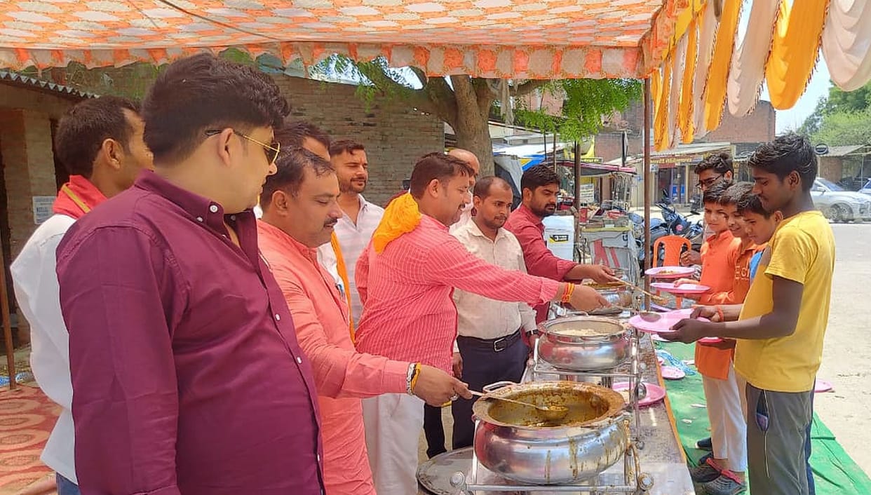 Community feasts held at various locations; chants of "Jai Bajrangbali" reverberate.
