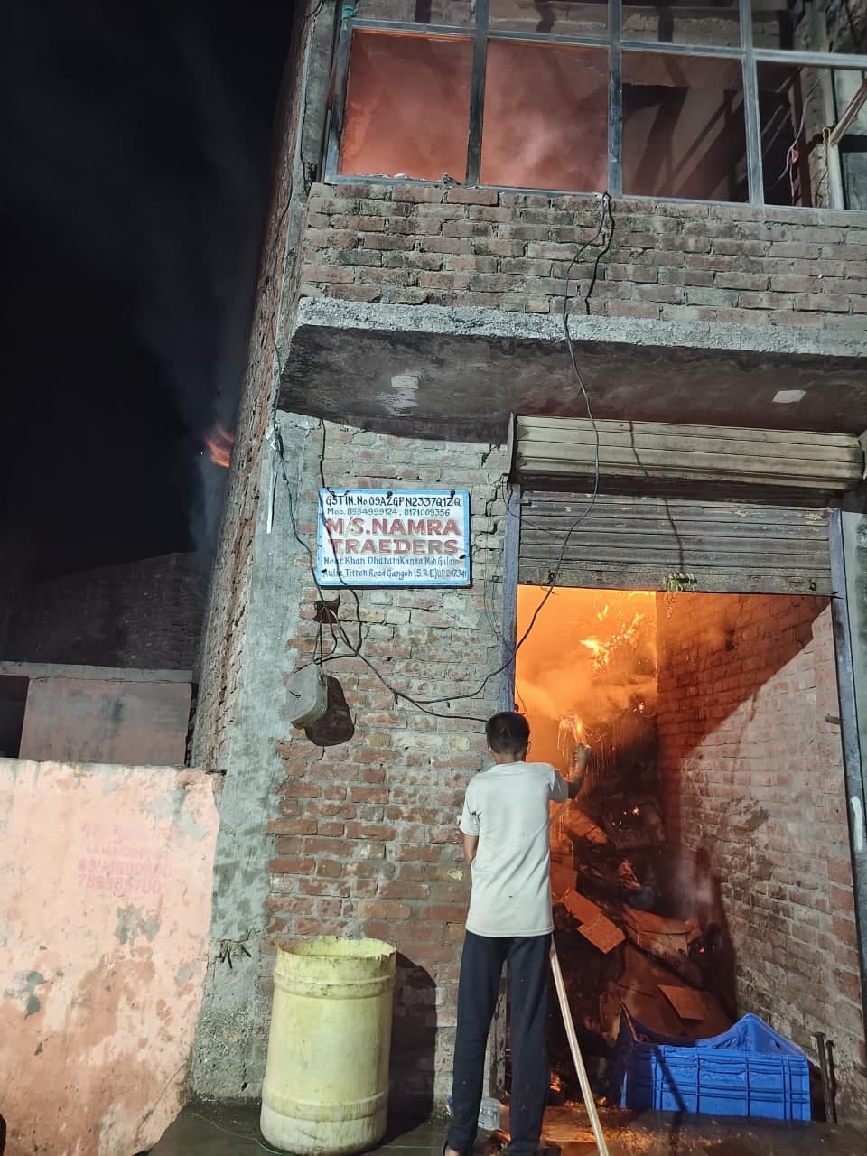 A massive fire broke out in a cardboard warehouse, killing three animals and injuring the owner.